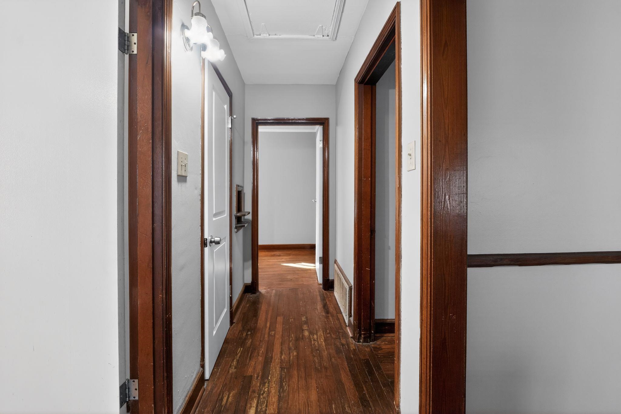 1068 Mt Vernon Road Memphis, TN 38111 - Photo 27 of 31 Hall with attic access and dark wood-style floors
