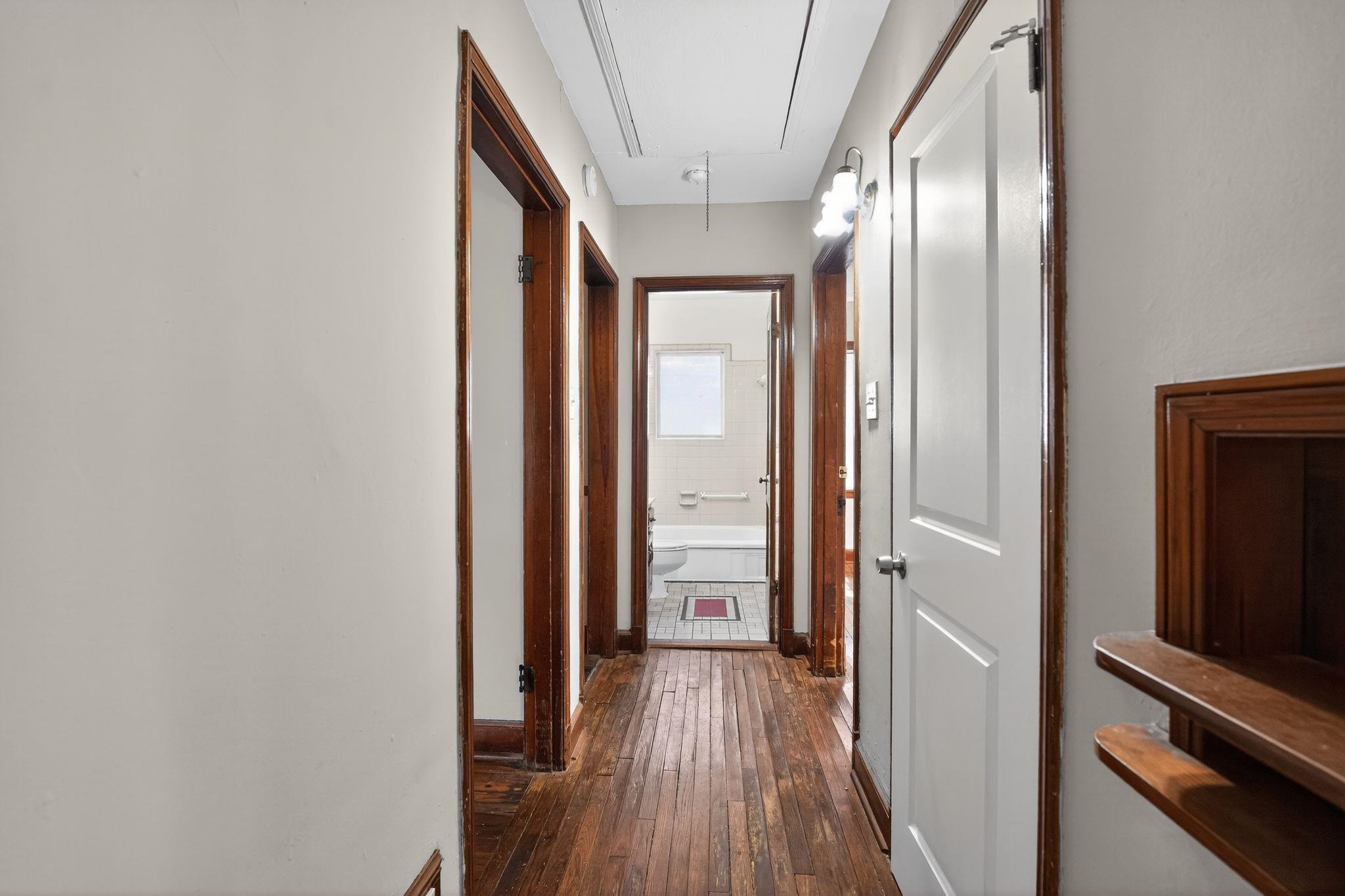 1068 Mt Vernon Road Memphis, TN 38111 - Photo 28 of 31 Hallway with attic access and dark wood-type flooring
