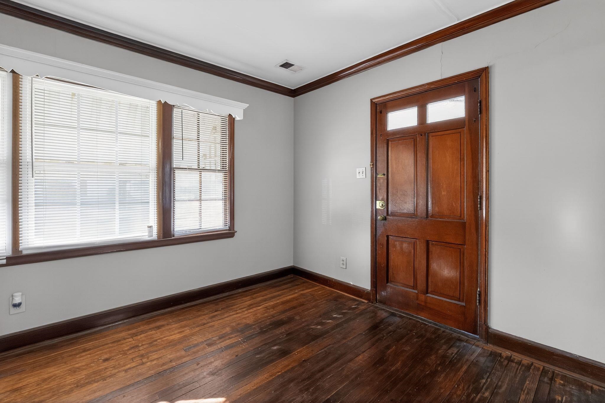 1068 Mt Vernon Road Memphis, TN 38111 - Photo 4 of 31 Foyer entrance with ornamental molding and dark wood-type flooring