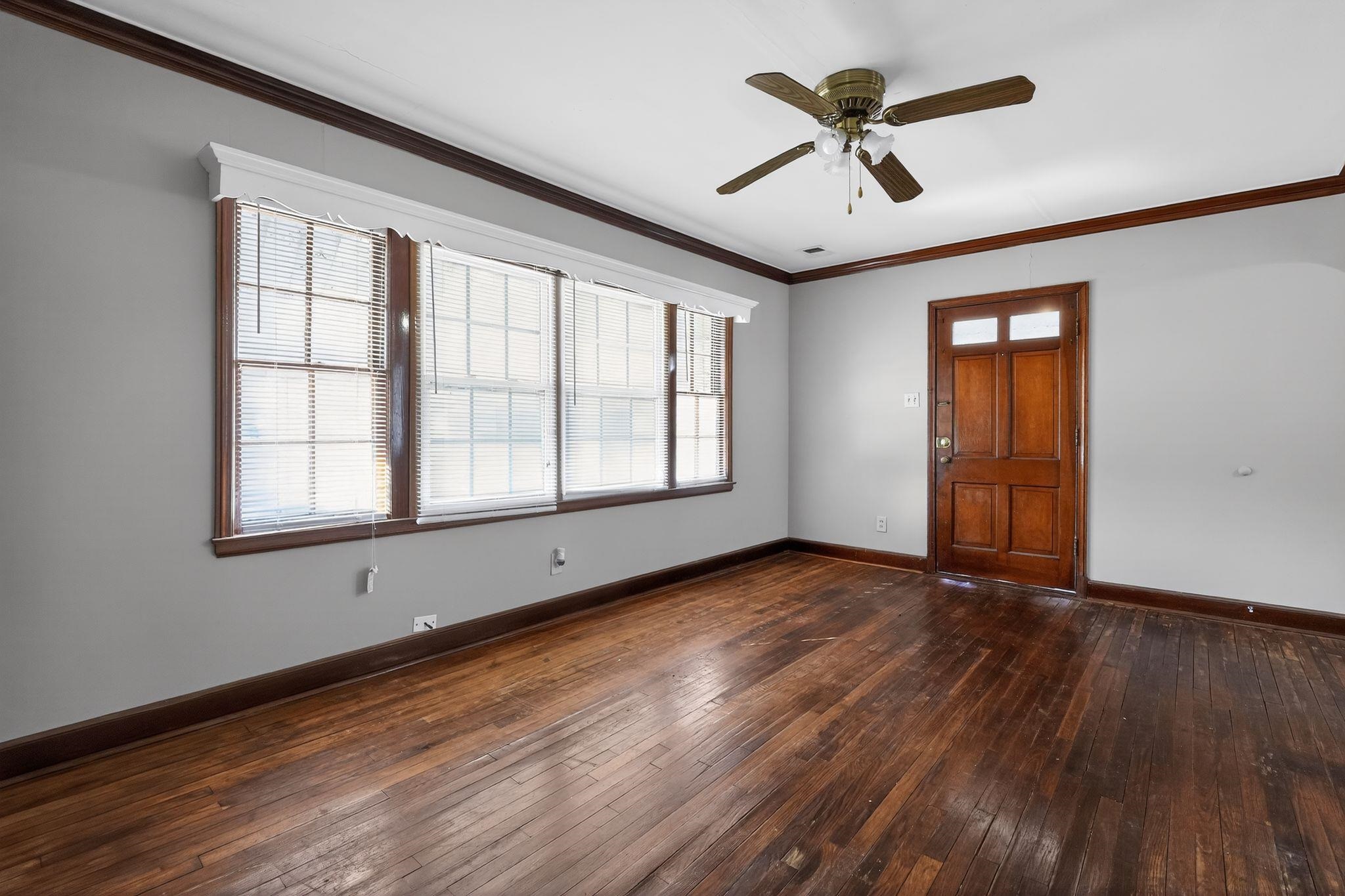 1068 Mt Vernon Road Memphis, TN 38111 - Photo 5 of 31 Foyer entrance with ornamental molding, a ceiling fan, and dark wood-style floors