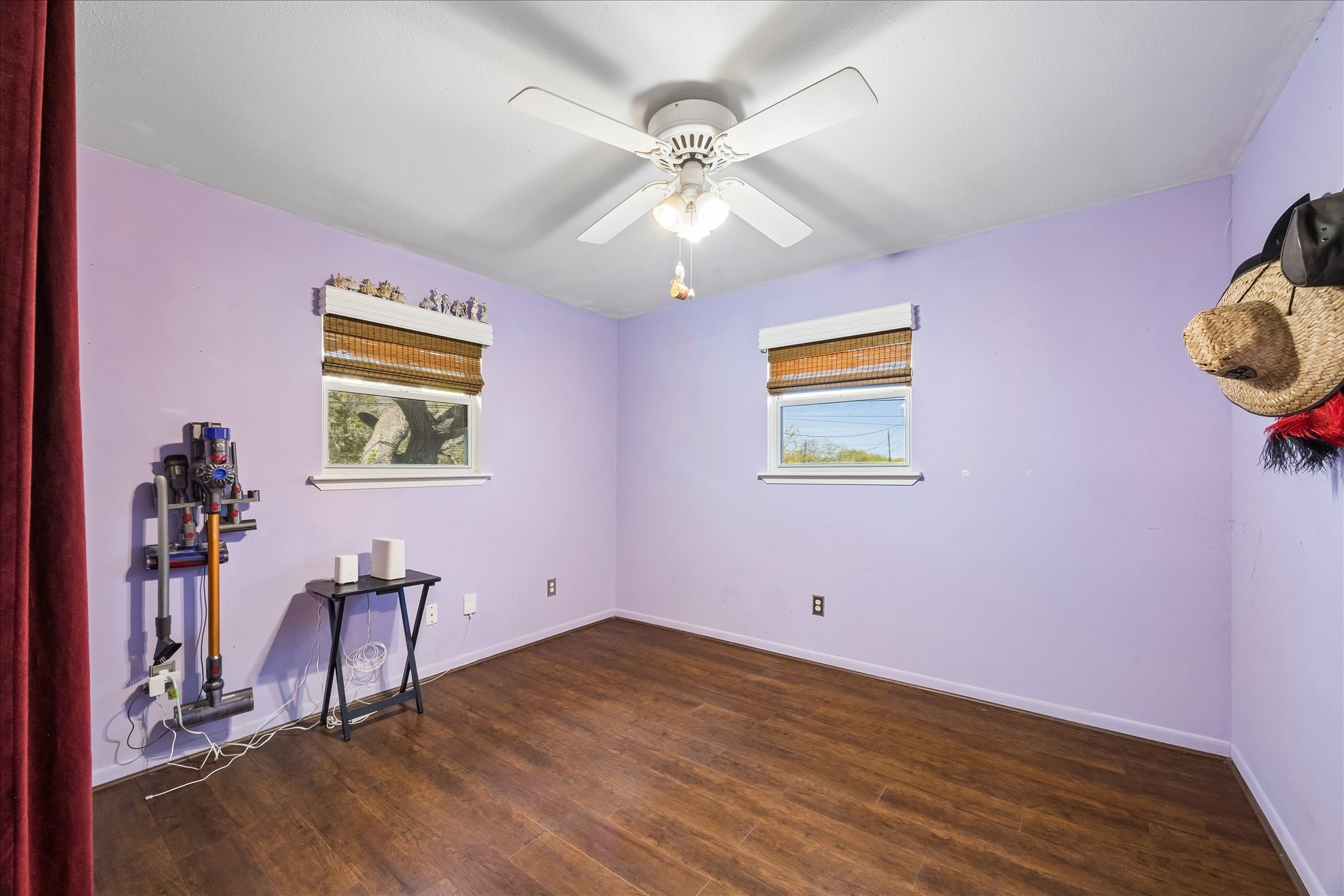 1009 3rd Street Seabrook, TX 77586 - Photo 11 of 20 a view of empty room with wooden floor and fan