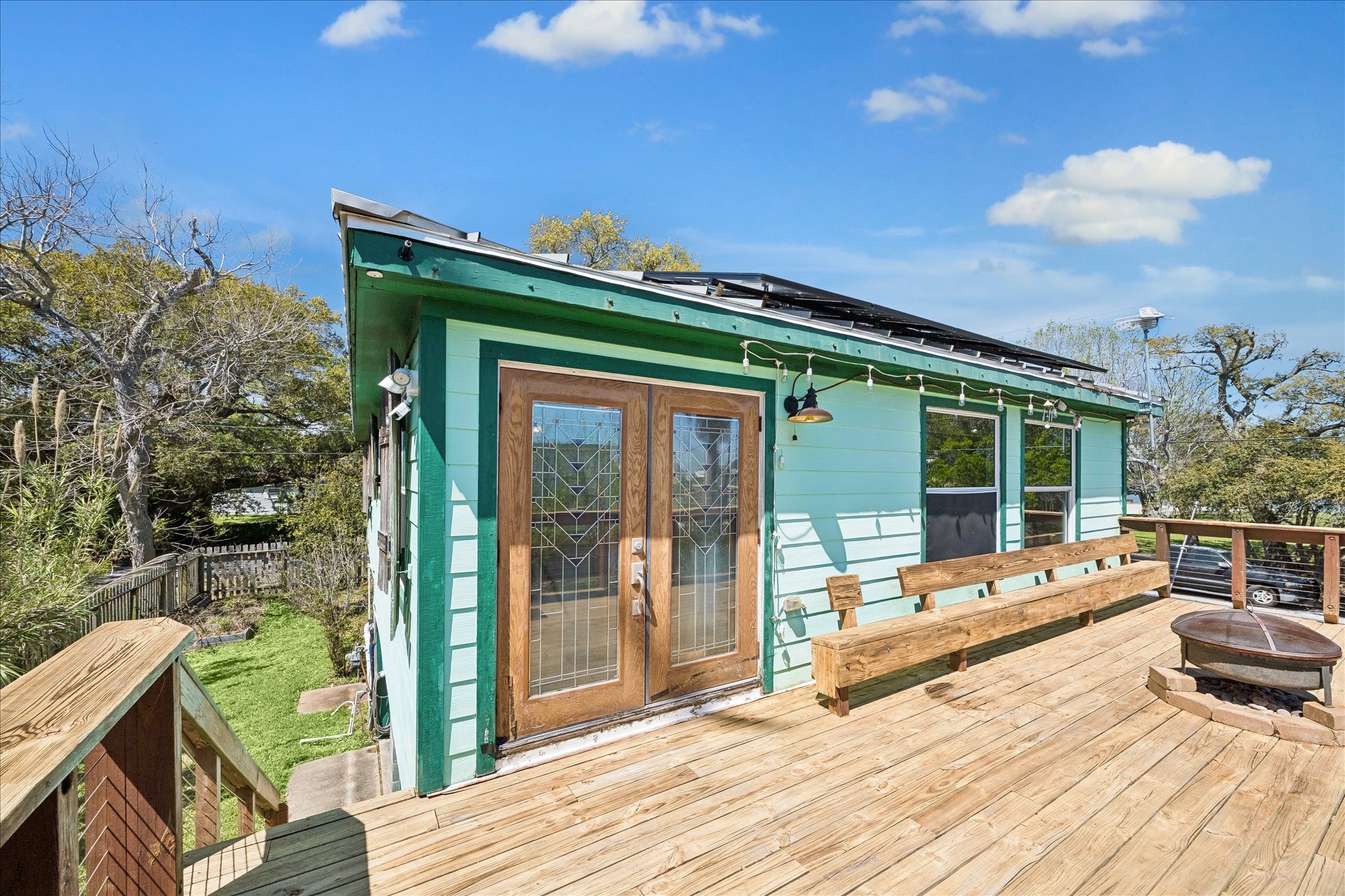 1009 3rd Street Seabrook, TX 77586 - Photo 15 of 20 a view of house with backyard outdoor seating and wooden floor
