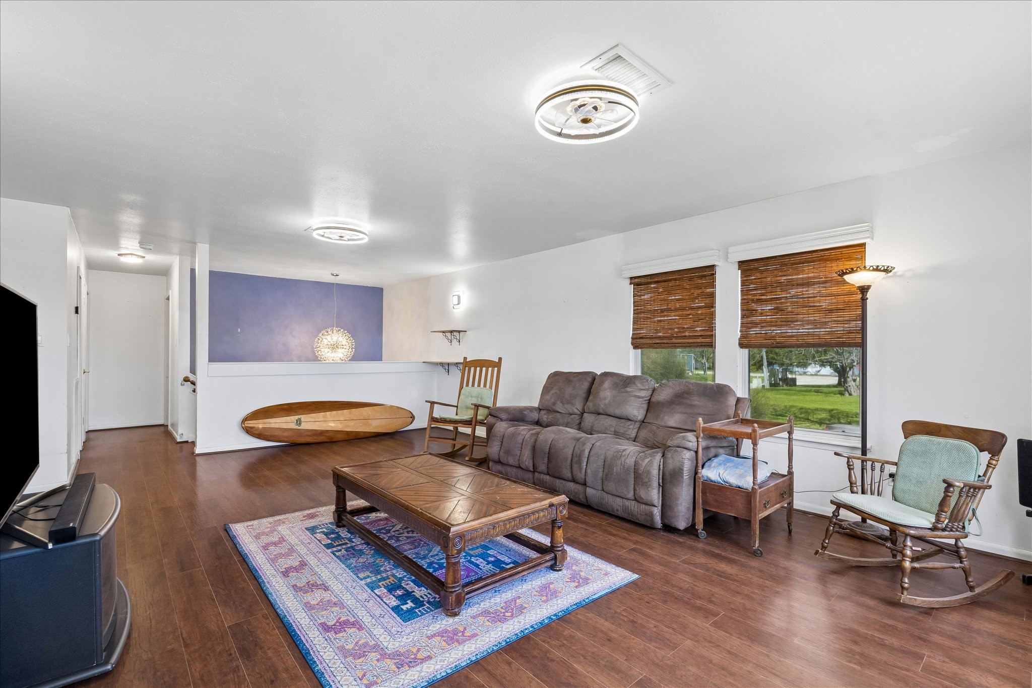 1009 3rd Street Seabrook, TX 77586 - Photo 3 of 20 a living room with furniture a rug and a large window