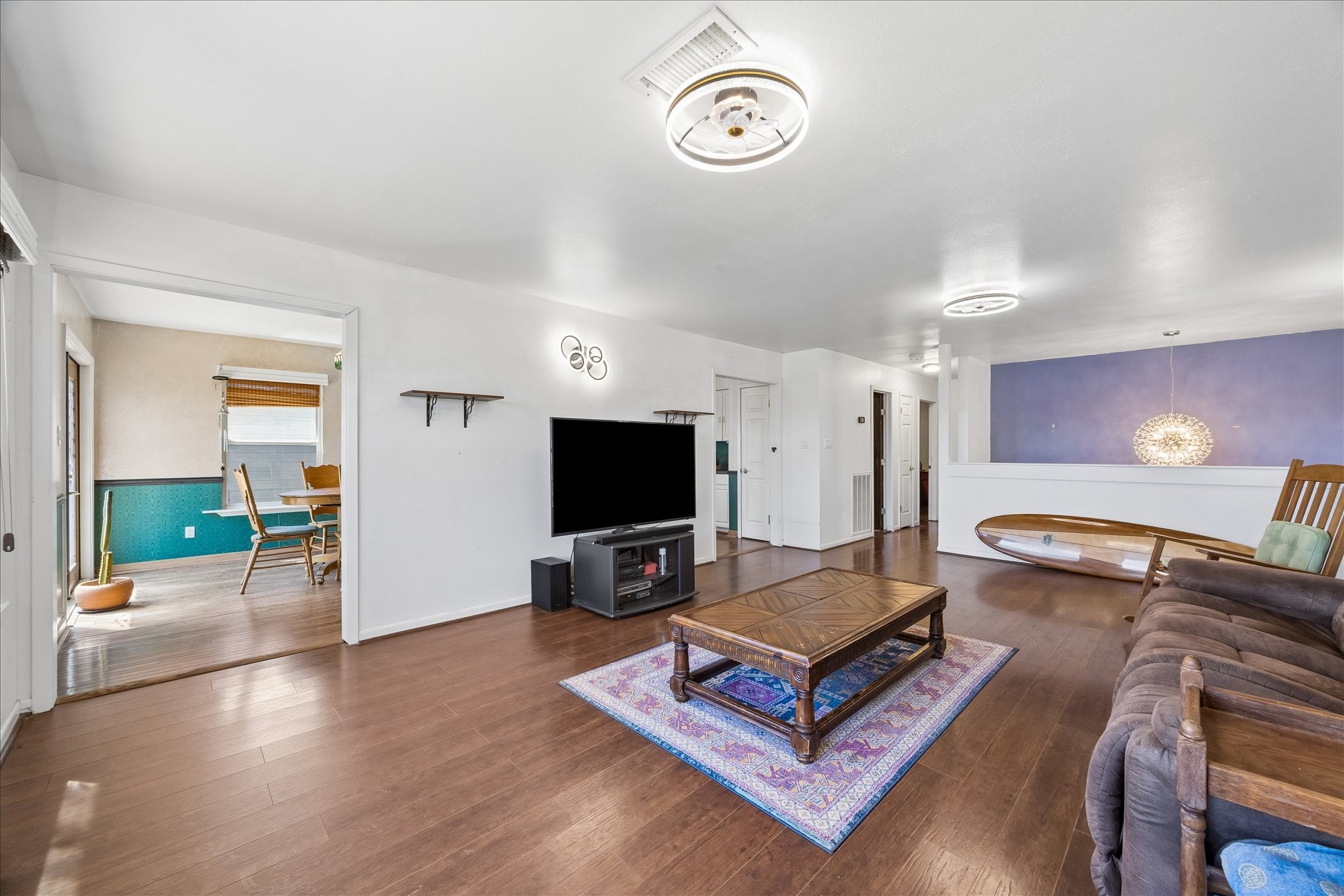 1009 3rd Street Seabrook, TX 77586 - Photo 4 of 20 a living room with furniture and a flat screen tv