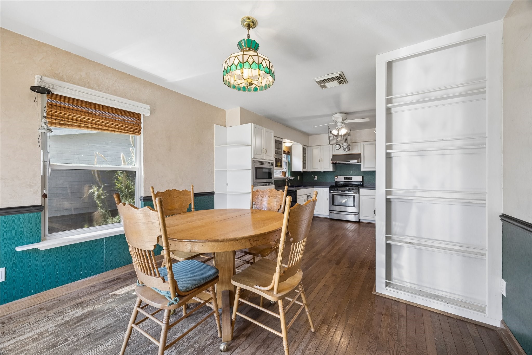 1009 3rd Street Seabrook, TX 77586 - Photo 8 of 20 a dining room with furniture and a kitchen view