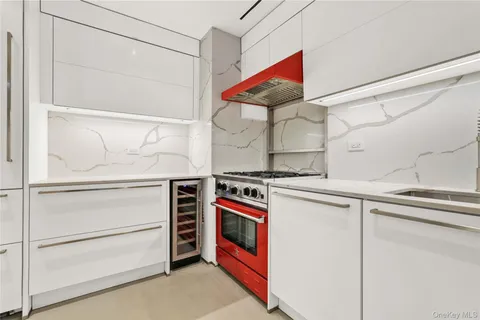 a kitchen with stainless steel appliances granite countertop a stove and a refrigerator