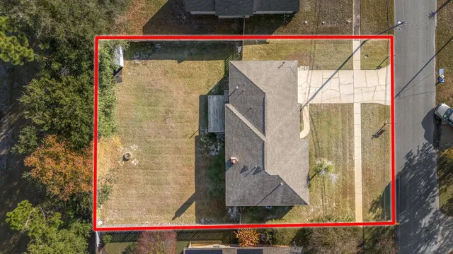 a bird view of a house with street