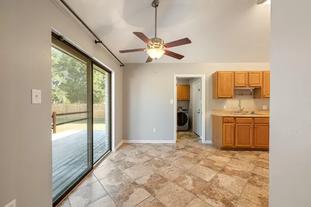 a view of a kitchen with a sink and cabinet area