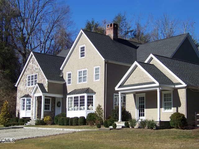 39 Warncke Road Wilton, CT 06897 - Photo 1 of 1 a front view of a house with a yard