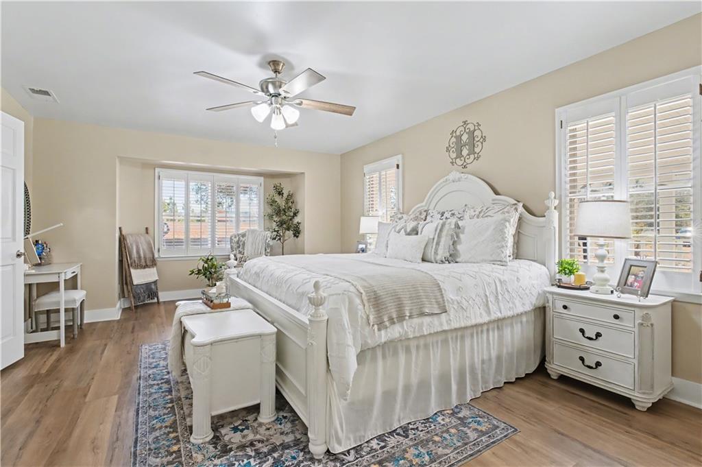 1833 Tom Odum Road Vidalia, GA 30474 - Photo 21 of 59 a bedroom with a bed and a chandelier