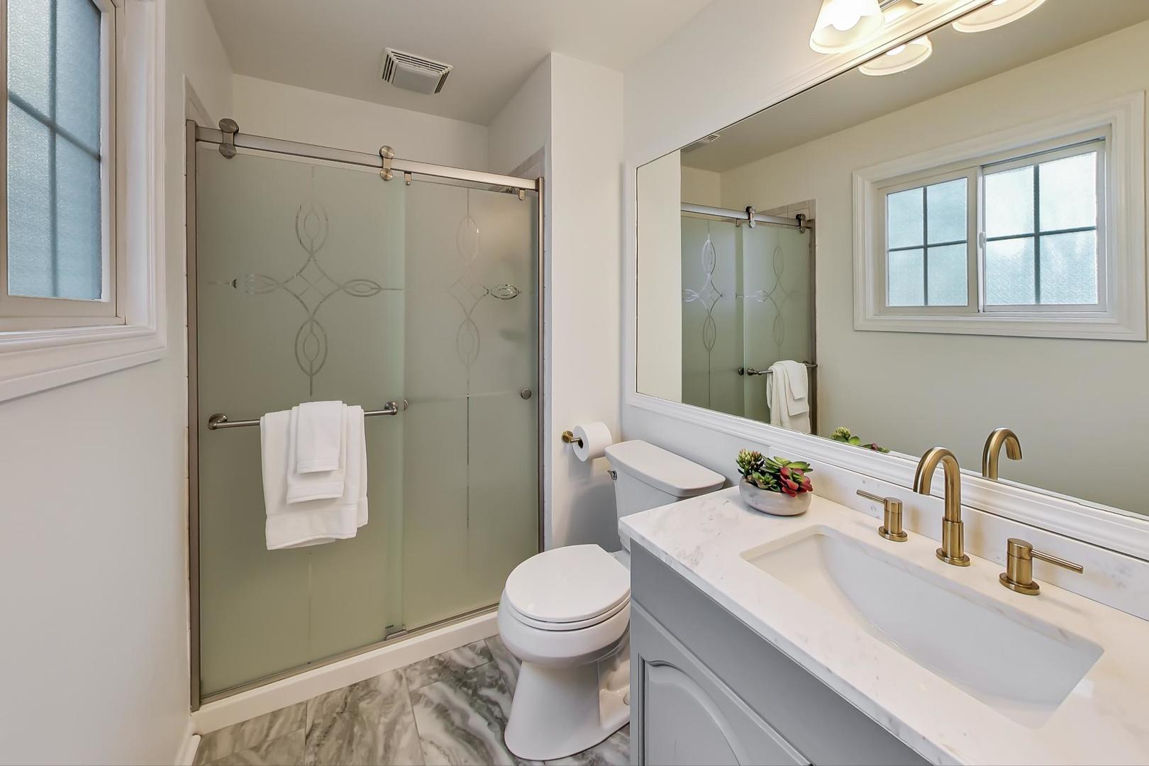 1920 Barberry Road Northbrook, IL 60062 - Photo 13 of 24 a bathroom with a sink a toilet and shower