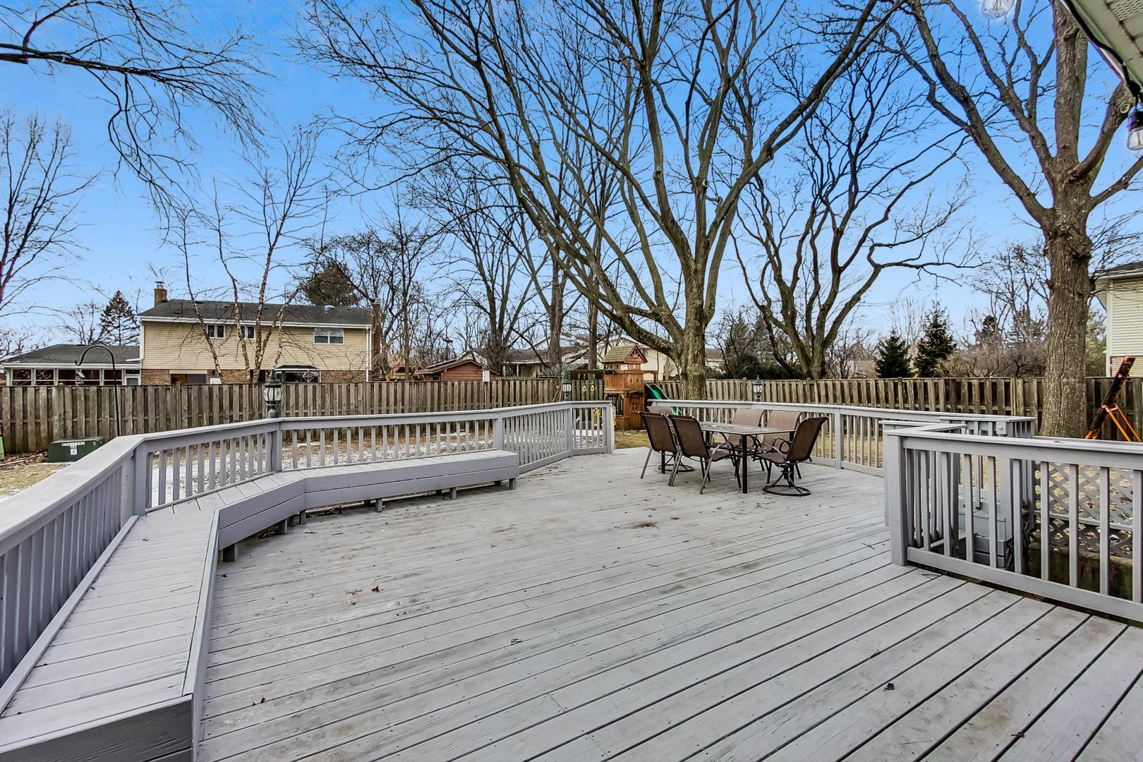 1920 Barberry Road Northbrook, IL 60062 - Photo 19 of 24 a view of a roof deck with table and chairs and wooden floor
