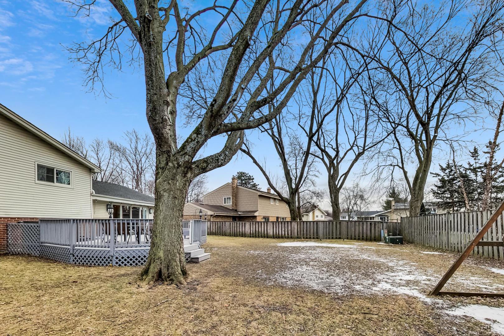 1920 Barberry Road Northbrook, IL 60062 - Photo 22 of 24 a view of large house with a yard covered in snow