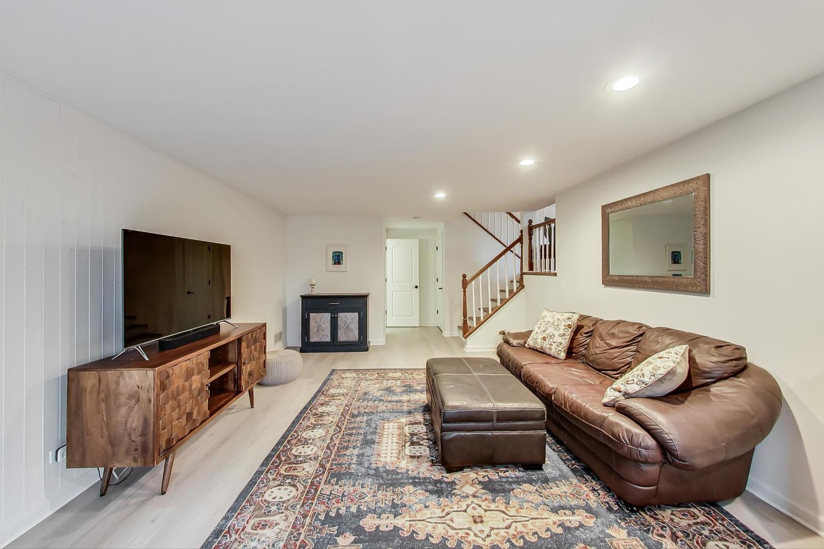 1920 Barberry Road Northbrook, IL 60062 - Photo 8 of 24 a living room with furniture and a flat screen tv