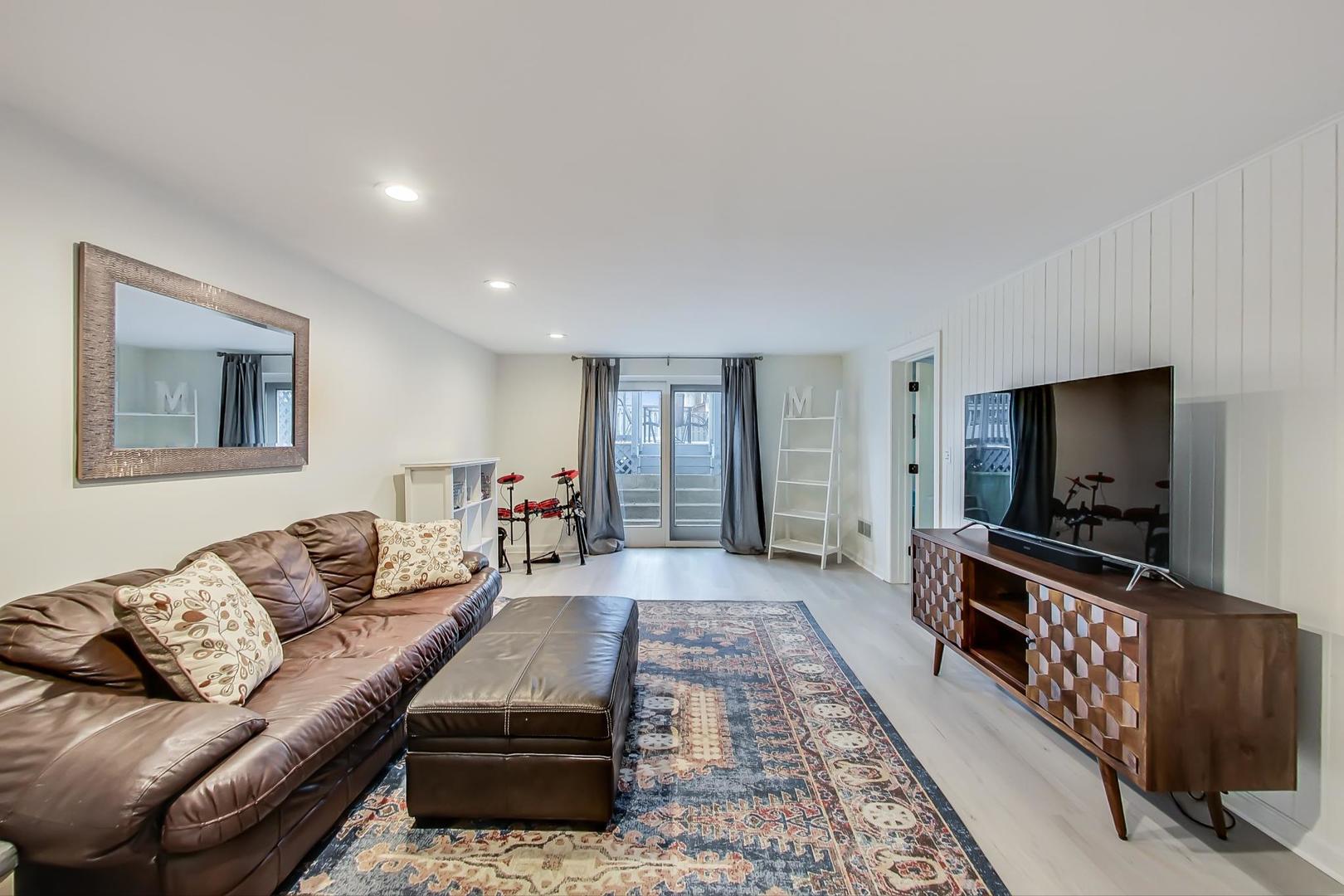 1920 Barberry Road Northbrook, IL 60062 - Photo 9 of 24 a living room with furniture and a flat screen tv
