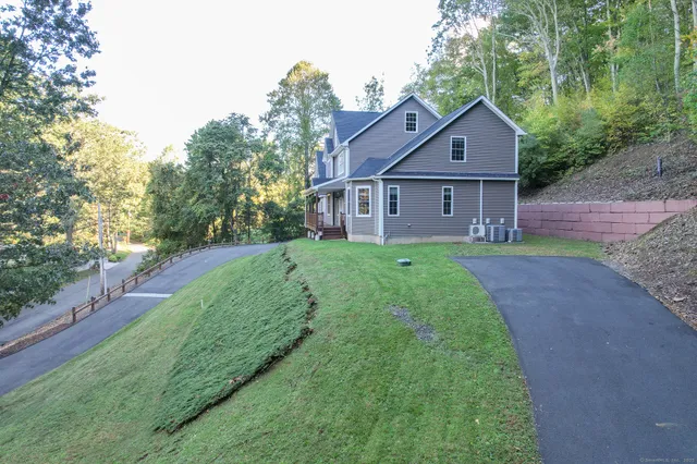 a front view of a house with yard