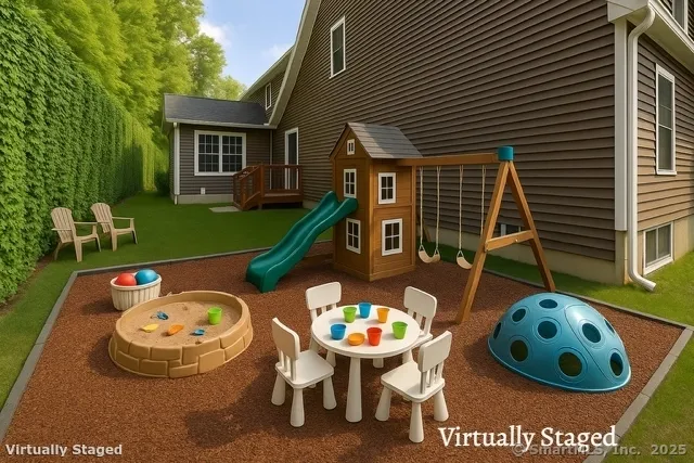 a view of a wooden chairs and table in front of house