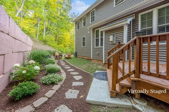 a view of a house with a small yard