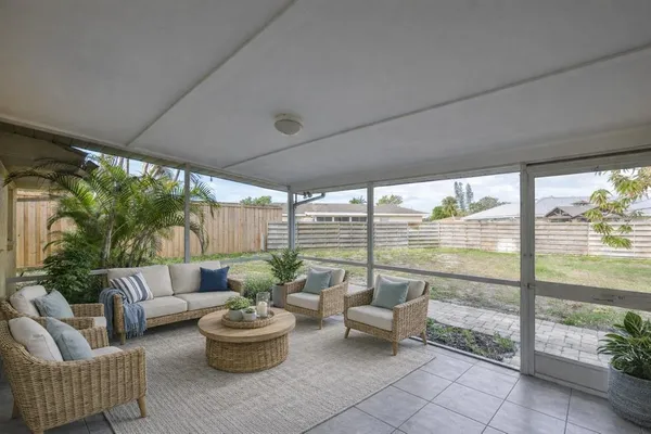 a living room with patio and a couches