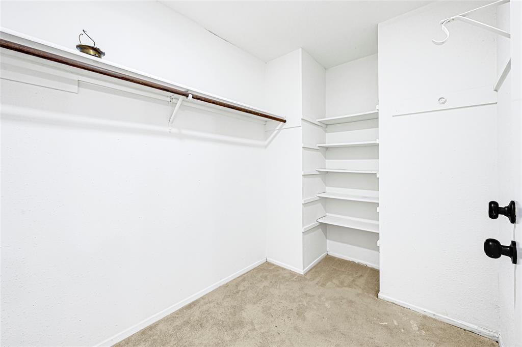 8302 Country Wind Lane Houston, TX 77040 - Photo 14 of 20 a view of an empty walk in closet