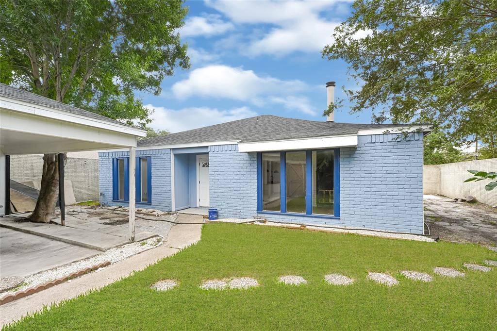8302 Country Wind Lane Houston, TX 77040 - Photo 2 of 20 a view of a house with a patio