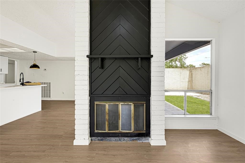8302 Country Wind Lane Houston, TX 77040 - Photo 8 of 20 a view of a kitchen with a sink and a window