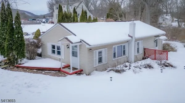 a aerial view of a house with a yard