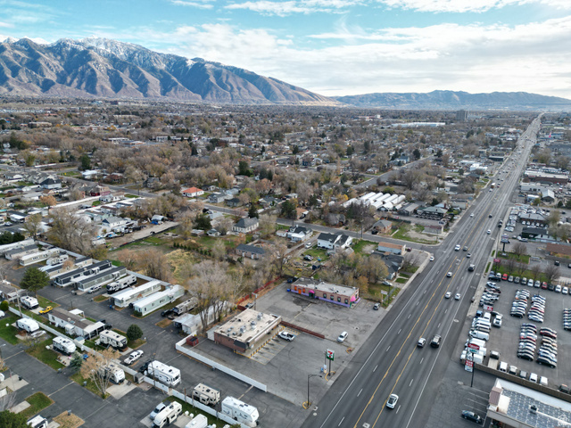 8475 South State Street Sandy, UT 84070 - Photo 11 of 31 Aerial overview of property's location with a mountainous background