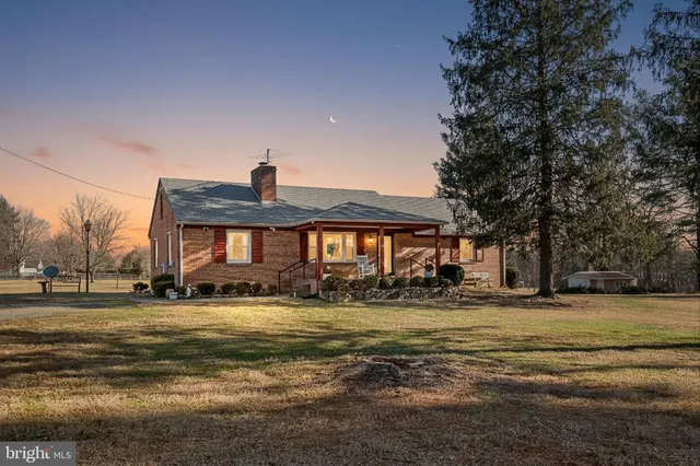 a front view of a building with a yard