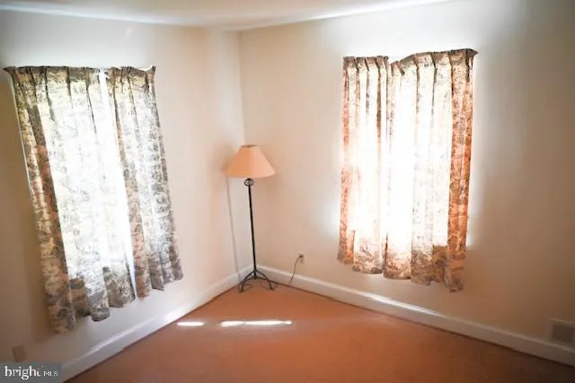 a view of a backyard with a small window