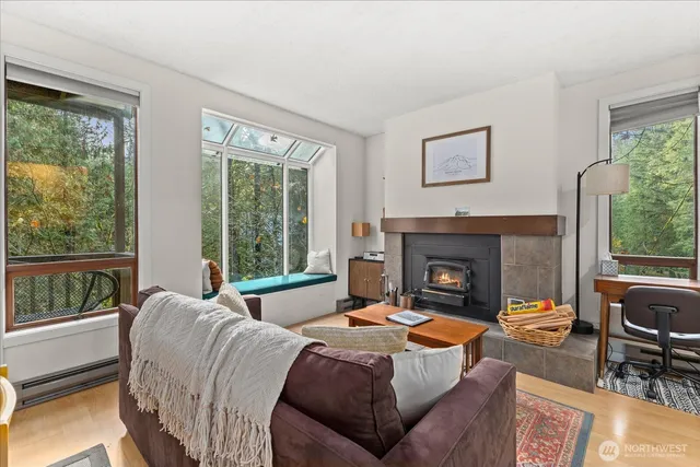 a bedroom with a bed and a fireplace