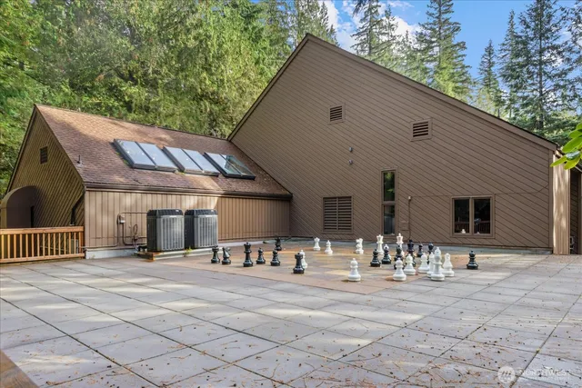 a view of a patio with a table and chairs
