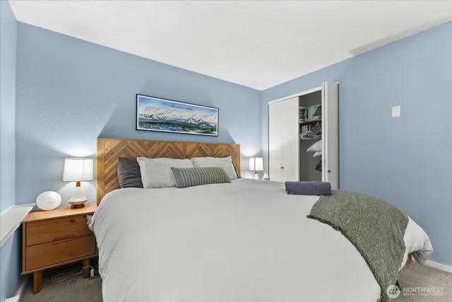 a bedroom with a bed and window