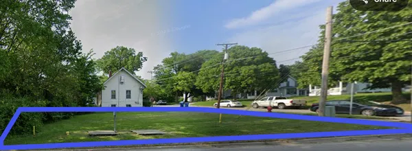 a view of yard with swimming pool and trees in the background