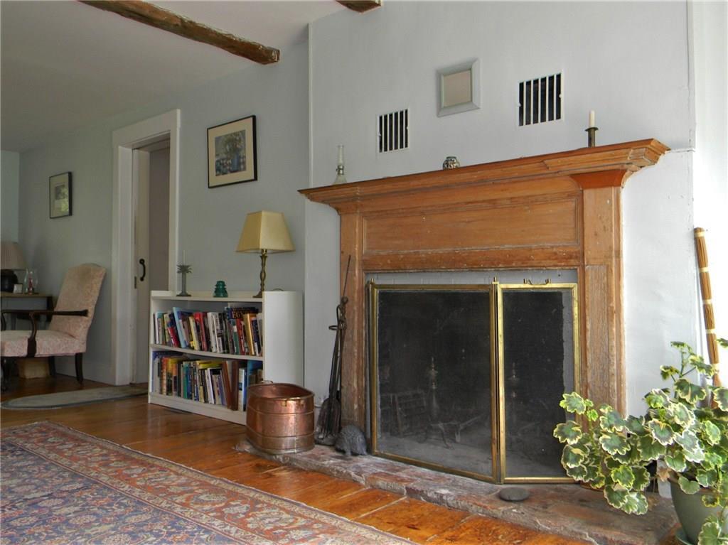 98 Cross Point Road Edgecomb, ME 04556 - Photo 8 of 35 Living Room fireplace with door...