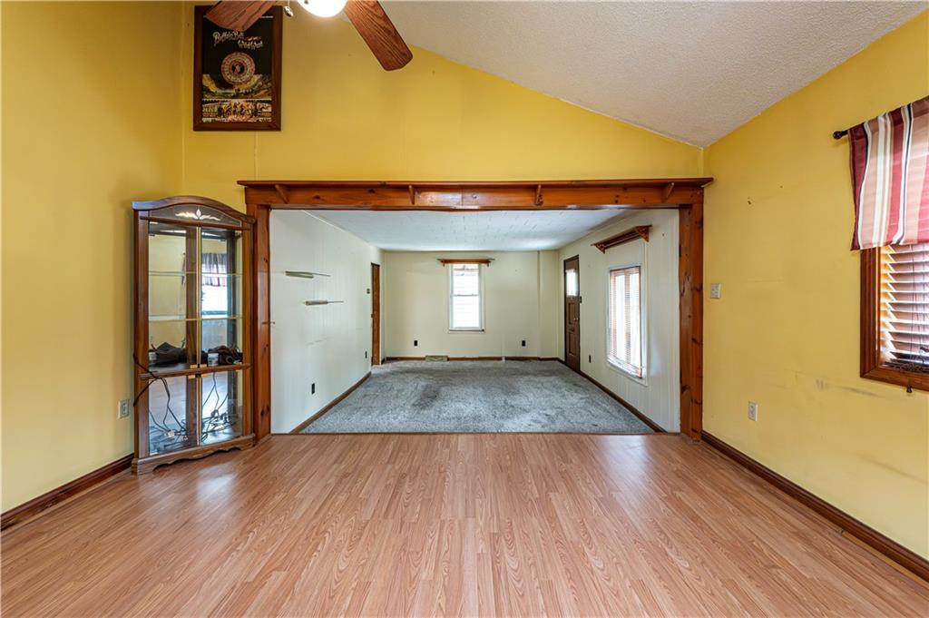 4 Miller Street Latrobe, PA 15650 - Photo 13 of 39 a view of a hallway with wooden floor and a bathroom