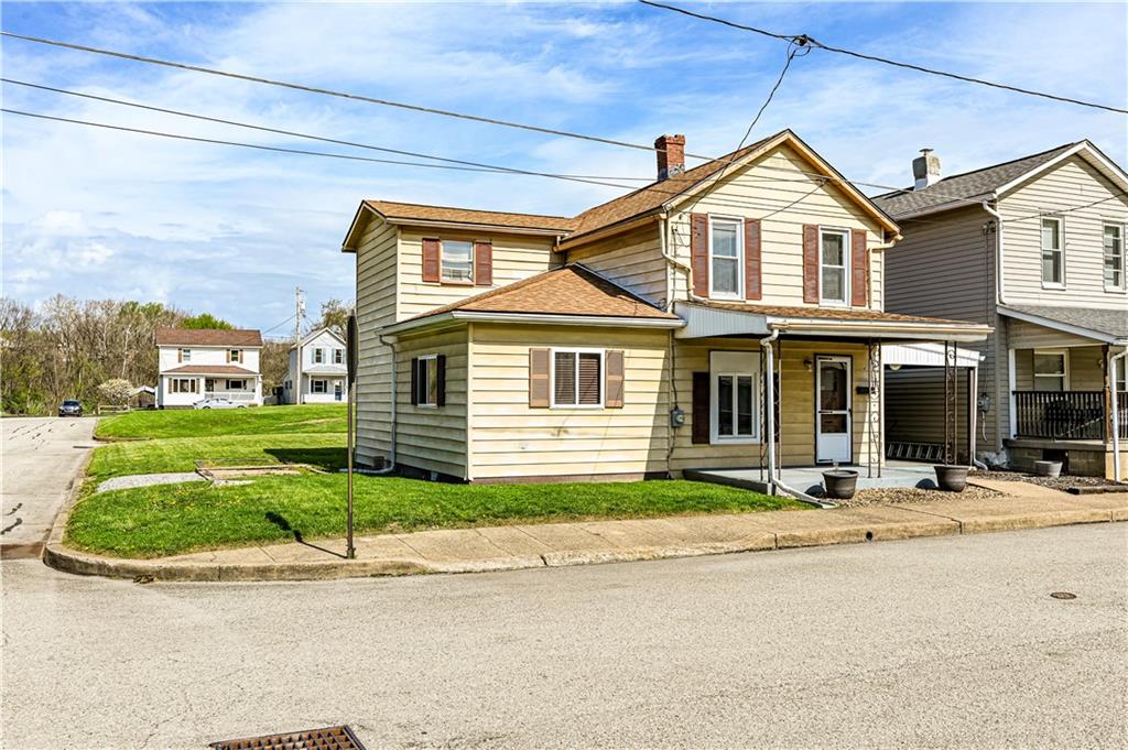 4 Miller Street Latrobe, PA 15650 - Photo 3 of 39 a front view of a house with a yard