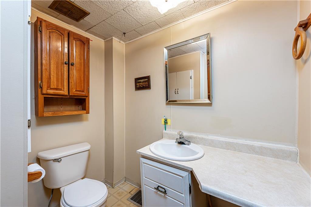 4 Miller Street Latrobe, PA 15650 - Photo 34 of 39 a bathroom with a sink toilet and mirror