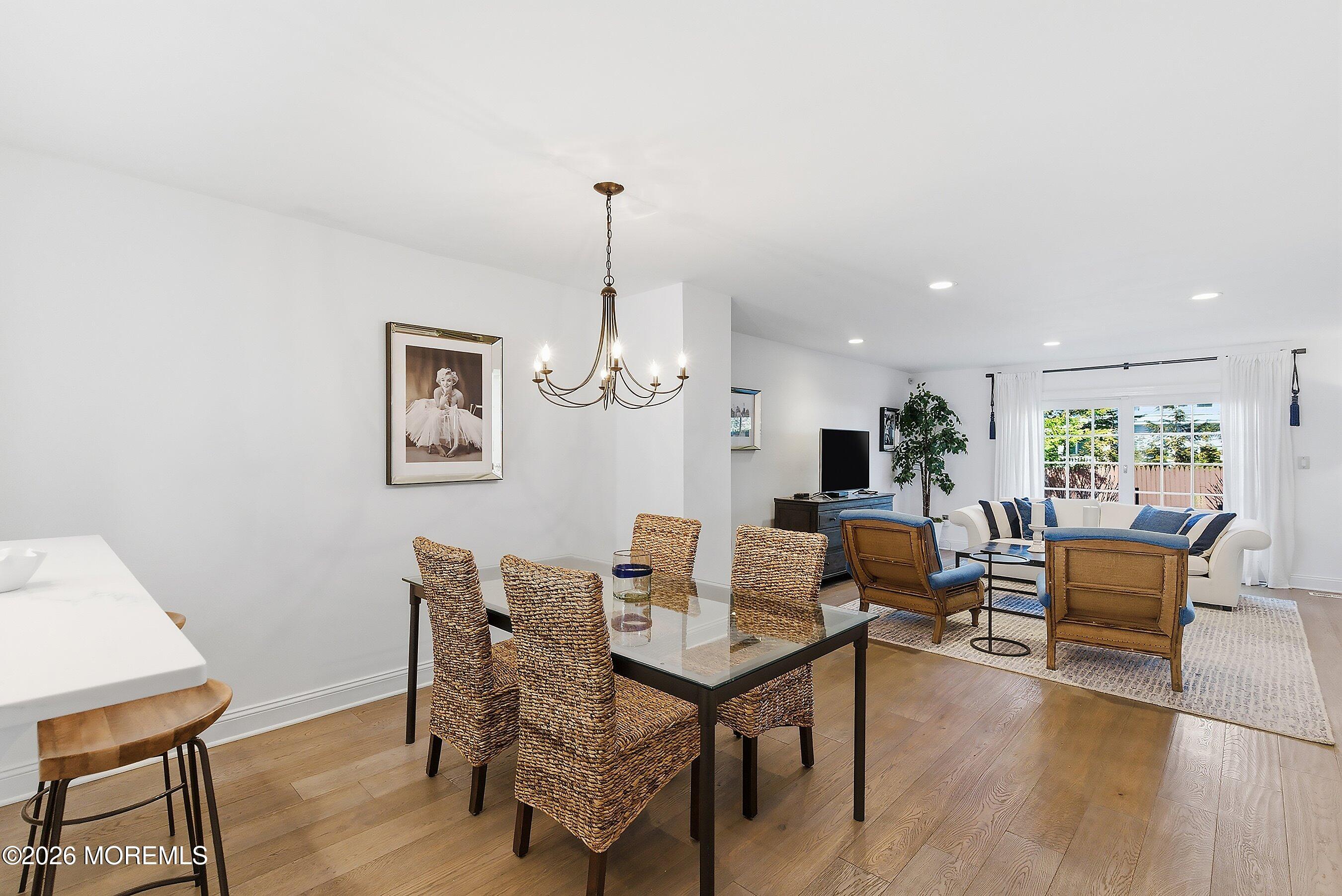 60 Wyckham Road Spring Lake Heights, NJ 07762 - Photo 11 of 26 a living room with furniture dining table and a wooden floor