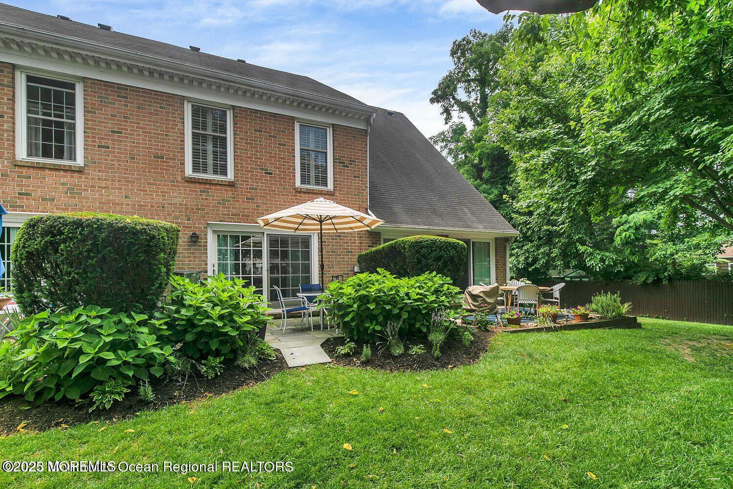 60 Wyckham Road Spring Lake Heights, NJ 07762 - Photo 24 of 26 a front view of a house with garden