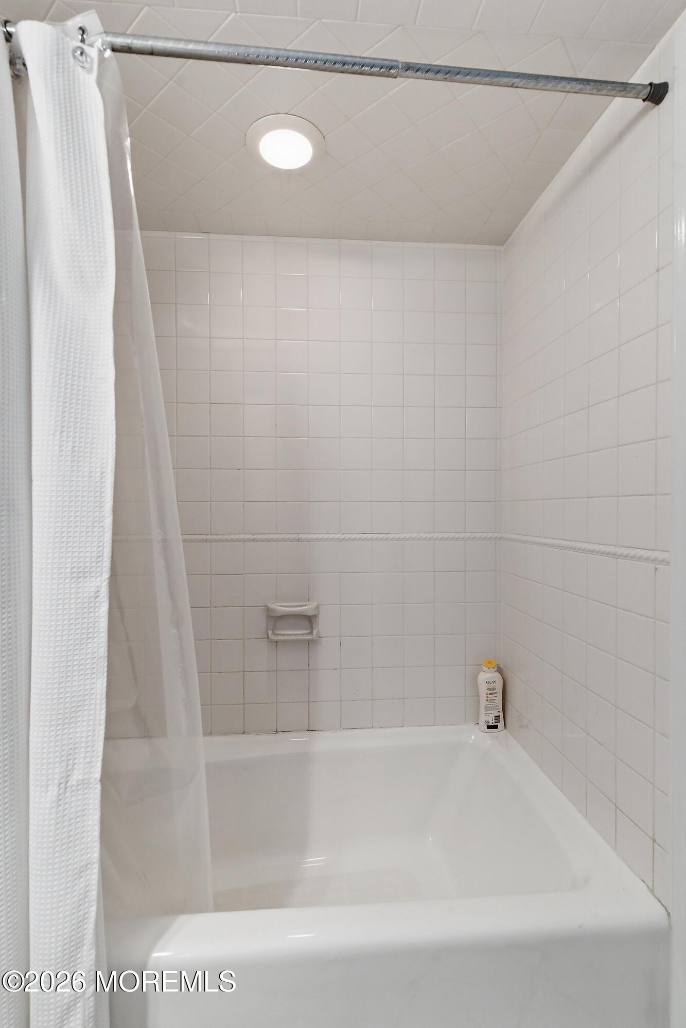 60 Wyckham Road Spring Lake Heights, NJ 07762 - Photo 26 of 26 a bathroom with a shower and a bath tub