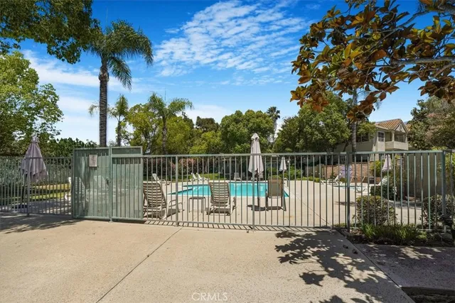a view of a wrought iron fences in front of house