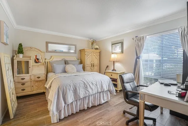 a bedroom with a bed and a table in it