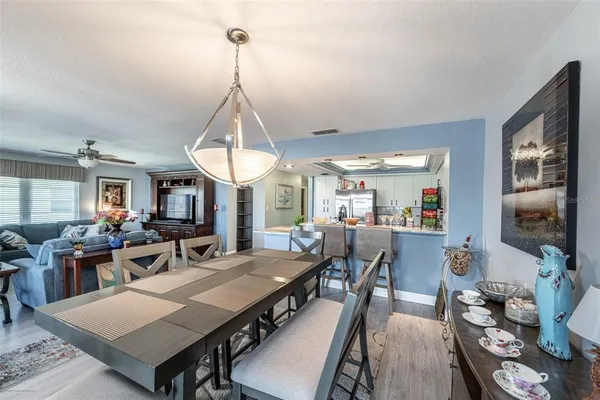 a view of a dining room with furniture window and outside view