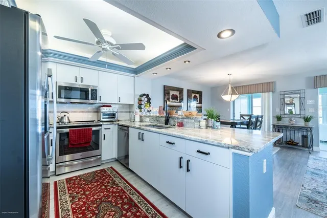 a bathroom with a sink a large mirror and a shower