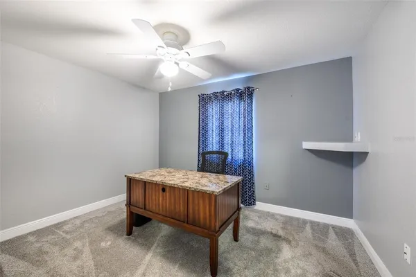 a bedroom with double bed and a furniture