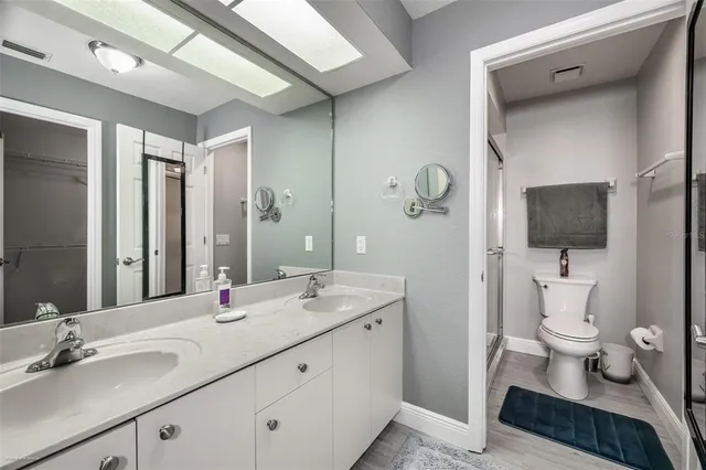 a view of washer and dryer with kitchen countertops