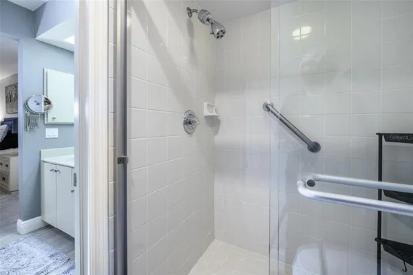 a view of room with floor to ceiling window and wooden floor