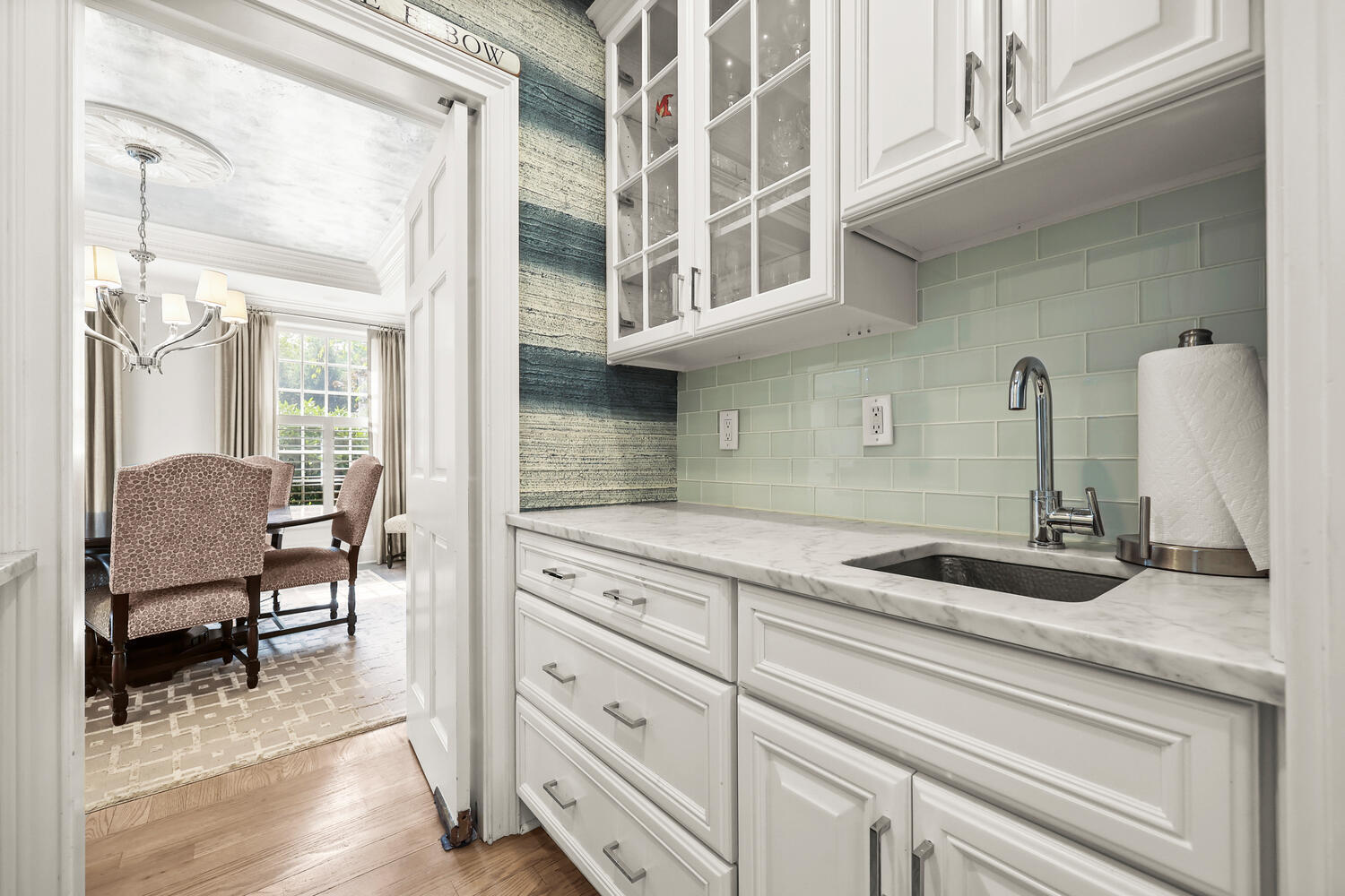 35 Logan Road New Canaan, CT 06840 - Photo 13 of 73 a kitchen with cabinets and chairs