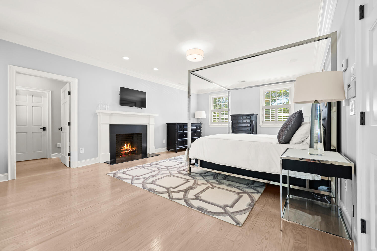 35 Logan Road New Canaan, CT 06840 - Photo 19 of 73 a living room with furniture a fireplace and a flat screen tv